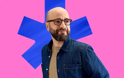 Employee with denim shirt in front of maple leaf bdc