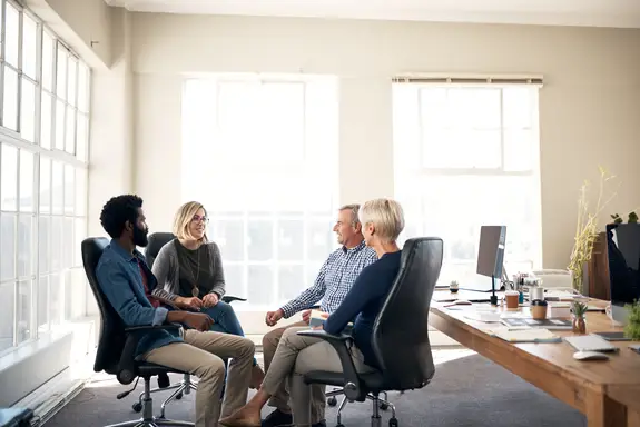 group of businesspeople having a meeting in a modern office