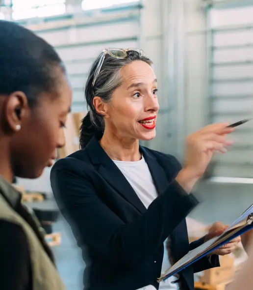 Three business women standing in an office